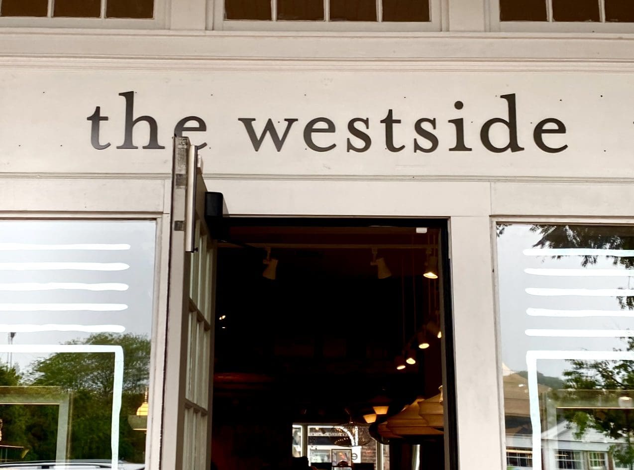 "The Westside" store entrance with open inviting door.