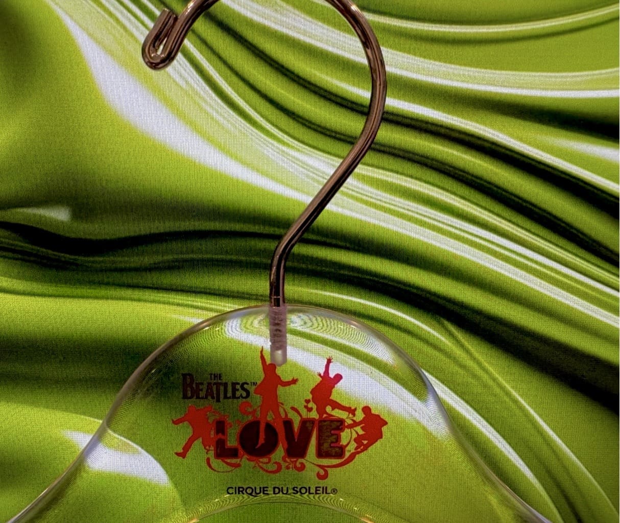 Transparent display with "The Beatles LOVE" branding.
