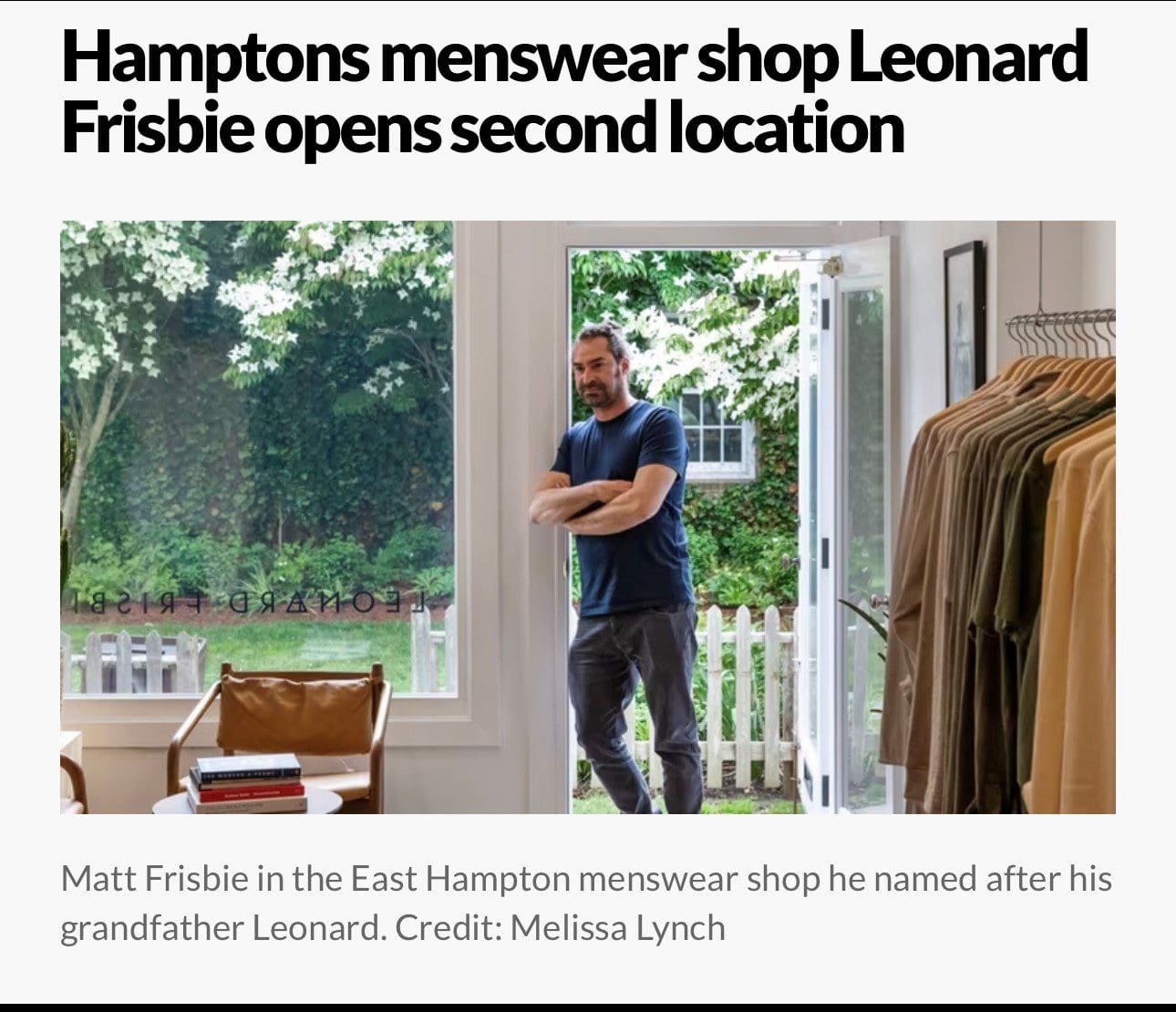 Matt Frisbie poses in Leonard Frisbie shop with garden.