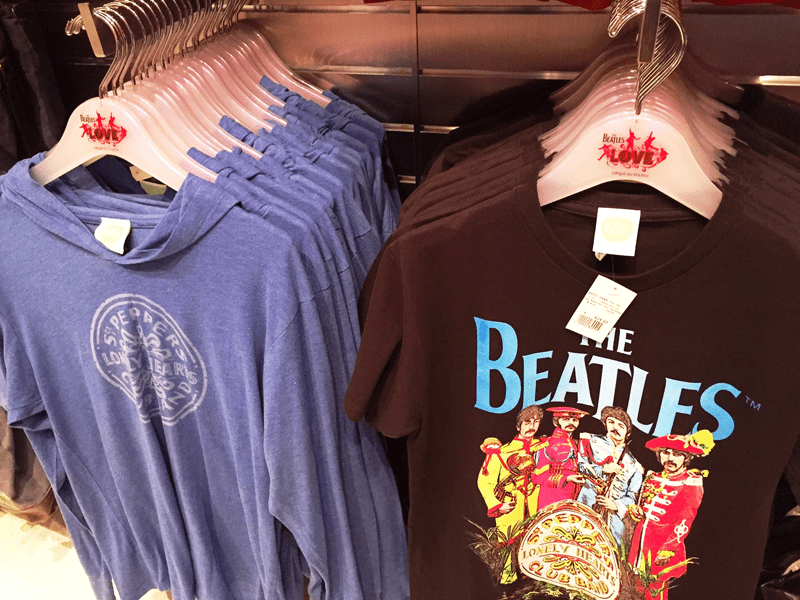 Store display with blue hoodies and Beatles t-shirt.