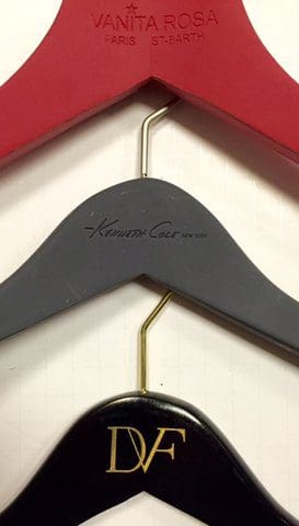 Three hangers display Vanita Rosa, Kenneth Cole, and DVF.