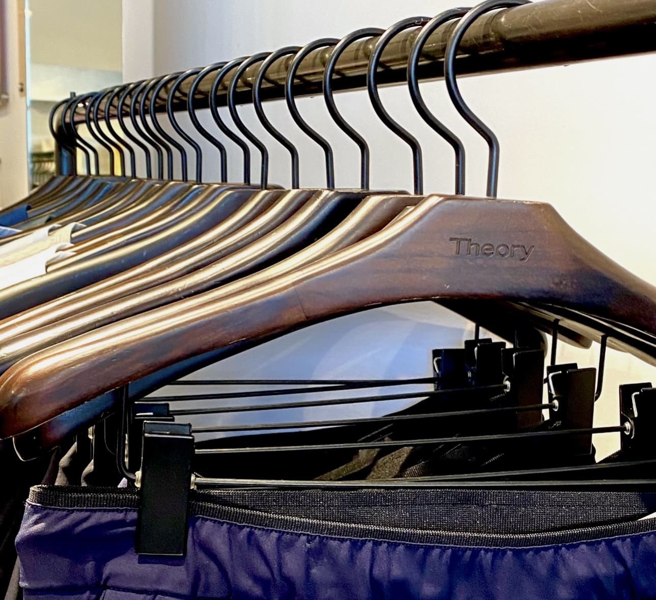 Wooden clothing hangers on rack
