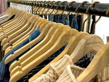 knit and jean clothing on hangers